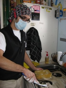 Luis cleaning the stovetop